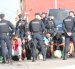 CEUTA (ESPAÑA), 13/09/2026.- La Policía Nacional está procediendo este domingo al traslado de cientos de migrantes que permanecían durmiendo en la calle a una nueva ubicación formada por varias carpas con la intención de evitar que continúen durmiendo a la intemperie. Según han informado a EFE fuentes policiales, el traslado se está produciendo desde primeras horas de esta mañana desde el emplazamiento de Loma Colmenar hacia unas carpas que han sido habilitadas junto a la antigua prisión de Los Rosales. EFE/ Reduan