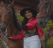 Uno de los videos publicados por Michelle Macías, la muestra junto a caballos en una producción musical.