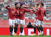 Los jugadores del Manchester United disfrutan la victoria ante el Liverpool.