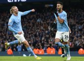Manchester City"s Riyad Mahrez (R) celebrates with Erling Haaland (L) after scoring the 3-0 goal during the English Premier League soccer match between Manchester City and Aston Villa in Manchester, Britain, 12 February 2023. (Reino Unido) EFE/EPA/Adam Vaughan EDITORIAL USE ONLY. No use with unauthorized audio, video, data, fixture lists, club/league logos or "live" services. Online in-match use limited to 120 images, no video emulation. No use in betting, games or single club/league/player publications