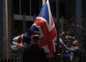 Staff members take down the United Kingdom"s flag from the European Parliament building in Brussels on Brexit Day, January 31, 2020. - Britain leaves the European Union at 2300 GMT on January 31, 2020, 43 months after the country voted in a June 2016 referendum to leave the block. The withdrawal from the union ends more than four decades of economic, political and legal integration with its closest neighbours. (Photo by JOHN THYS / AFP)
