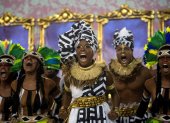 (FILES) In this file photo taken on March 05, 2019 members of Mangueira samba school perform during the second night of Rio"s Carnival parade at the Sambadrome in Rio de Janeiro, Brazil. - In a Brazil deeply polarized by President Jair Bolsonaro"s far-right politics, Mangueira -due to parade February 23 in the first of two nights of flesh-flaunting, sequin-studded spectacle- will depict Jesus returning to Earth in one of the city"s impoverished favelas, in the body of a black woman with indigenous roots, and preaching a message of tolerance. (Photo by Mauro Pimentel / AFP)