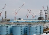 This picture taken on February 3, 2020 shows (from L) units one to three reactor buildings and storage tanks for contaminated water at the Tokyo Electric Power Company"s (TEPCO) Fukushima Daiichi nuclear power plant in Okuma, Fukushima prefecture. - Nine years after the disaster at the Fukushima Daiichi nuclear plant sparked by a devastating tsunami, clean-up and decommissioning continues at the crippled facility. (Photo by Kazuhiro NOGI / AFP)