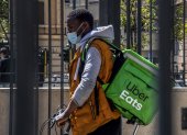 A delivery man exits with his bicycle the San Giovani underground metro station during a test phase in Rome, on April 27, 2020, during the country"s lockdown aimed at curbing the spread of the COVID-19 infection, caused by the novel coronavirus. - First tests were under way for subway access with security measures to avoid coronavirus infection in "Phase 2", that will re-open on May 4. (Photo by Tiziana FABI / AFP)
