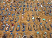 Aerial view of an area at the Nossa Senhora Aparecida cemetery where new graves have been dug in Manaus, Brazil, on May 22, 2020 amid the novel Covid-19 coronavirus pandemic. - Brazil, the hardest-hit Latin American country in the coronavirus pandemic, has surpassed 20,000 deaths, according to Brazil"s Ministry of Health (Photo by MICHAEL DANTAS / AFP)