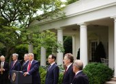 US President Donald Trump holds a press conference on China on May 29, 2020, in the Rose Garden of the White House in Washington, DC. With Trump are (L-R) Director of Trade and Manufacturing Policy Peter Navarro, National Security Advisor Robert O"Brien, US Secretary of State Mike Pompeo, US Secretary of the Treasury Steven Mnuchin, Trade Representative Robert Lighthizer, and Director of the National Economic Council Larry Kudlow. Trump said Friday that the US will restrict Chinese students and start reversing Hong Kong"s special status in customs and other areas as Beijing imposes a controversial security law. / AFP / MANDEL NGAN

 US-China-diplomacy-HEALTH-VIRUS-HongKong-TRUMP