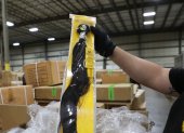 This handout photograph obtained July 1, 2020 courtesy of US Customs and Border Protection Office of Public Affairs and taken on June 29, 2020 shows Officers of Customs and Border Protection (CBP) Office of Field Operations (OFO) at the Port of New York/Newark inspecting a shipment of hair pieces and accessories from China, part of which is suspected to have been made with forced or prison labor in violation of US Law. - US customs officials said July 1, 2020 that they had seized a shipment of human hair products from China believed to be produced by Muslims held in labor camps in the country"s western Xinjiang province. (Photo by Handout / US Customs and Border Protection / AFP) / RESTRICTED TO EDITORIAL USE - MANDATORY CREDIT "AFP PHOTO /US Customs and Border Protection Office of Public Affairs " - NO MARKETING - NO ADVERTISING CAMPAIGNS - DISTRIBUTED AS A SERVICE TO CLIENTS