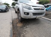Varios problemas en la Av. Benjamin Carrión, entre ellos los baches Agencia (ag-extra)