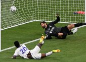 Vinicius Junior (L) of Real Madrid scores the opening goal during the UEFA Champions League final between Liverpool FC and Real Madrid at Stade de France in Saint-Denis, near Paris, France, 28 May 2022.
