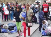 Fotografía de archivo en la que se registró a un grupo de migrantes venezolanos, en la frontera entre Colombia y Ecuador.