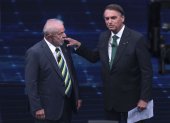 El exmandatario progresista Luiz Inácio Lula da Silva (i) y el ultra derechista Jair Bolsonaro (d) participaron del primer debate presidencial.