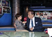 Con su nieto, Alfonso.