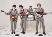 Los Beatles en acción.
