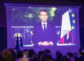Paris (France), 09/06/2024.- Supporters of presidential party RE Renaissance watch French President Emmanuel Macron"Äôs speech displayed on the screen at the electoral party after the announcement of the results in Paris, France, 09 June 2024, after the first results of the European Elections. The list of the Rassemblement National, led by party chief Jordan Bardella, is given winner in France, according to first estimations after polls. Macron called for a snap legislative election after the defeat in the EU votes. (Elecciones, Francia, Jordania) EFE/EPA/CHRISTOPHE PETIT TESSON