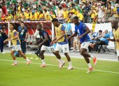 Parte de la plantilla de jugadores de la Tri en el calentamiento previo del partido ante México.
