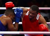 Villepinte (France), 29/07/2024.- Gerlon Gilmar Congo Chala of Ecuador (red) and Abner Teixeira da Silva Junior of Brazil (blue) fight in their Men"s 92kg round of 16 bout of the Boxing competitions in the Paris 2024 Olympic Games, at the North Paris Arena in Villepinte, France, 29 July 2024. (Brasil, Francia) EFE/EPA/DIVYAKANT SOLANKI