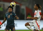 Ecuador"s defender #17 Angelo Preciado and Peru"s  midfielder  #18 Andre Carrillo fight for the ball during the 2026 FIFA World Cup South American qualifiers football match between Peru and Ecuador at the National stadium in Lima, on June 10, 2025. (Photo by ERNESTO BENAVIDES / AFP)