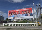 Un cartel electoral del Partido Progresista del Pueblo/Cívico (PPP/C) de Guyana, encabezado por el actual presidente Irfaan Ali.