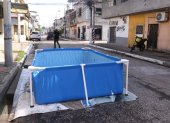 El crimen se cometió en medio de un festejo por el que se había puesto una piscina en la calzada para que jueguen los niños.