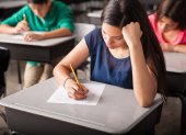 Group of high school students taking a test in a classroom
