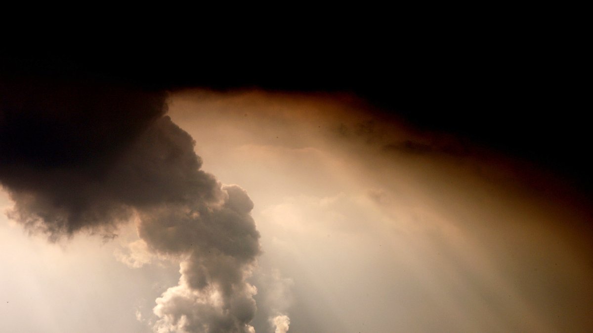 Picture taken on September 30, 2009 shows smoke and vapor rising from the cooling towers and chimneys of the lignite-fired po