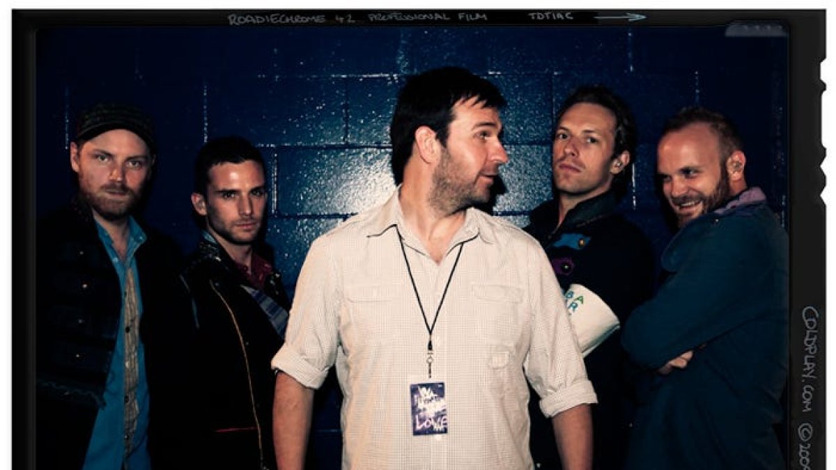 Colplay y su manager Dave Holmes.