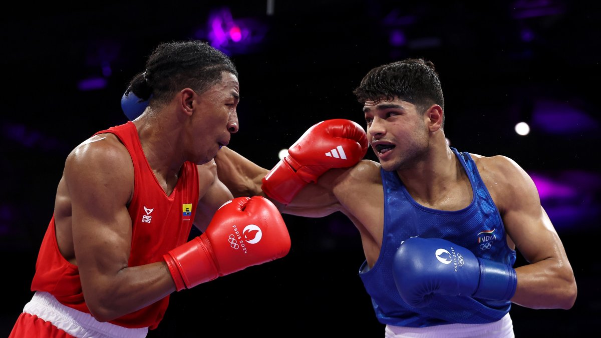 José Rodríguez (i) en su primer combate en unos Juegos Olímpicos