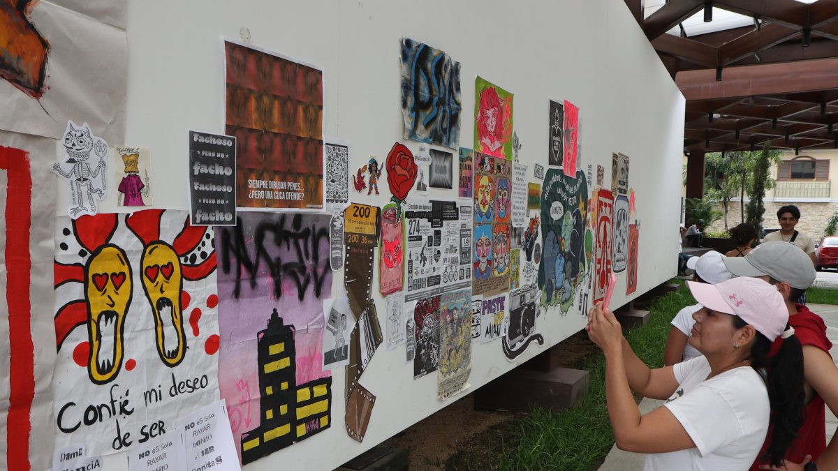La técnica de paste-up, que consiste en pegar imágenes diseñadas en paredes del espacio público, se aplicó en la feria de Conciencia Positiva.