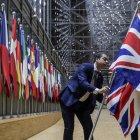 EU Council staff members remove the United Kingdom"s flag from the European Council building in Brussels on Brexit Day, January 31, 2020. Britain leaves the European Union at 2300 GMT on January 31, 2020, 43 months after the country voted in a June 2016 referendum to leave the block. The withdrawal from the union ends more than four decades of economic, political and legal integration with its closest neighbours. / AFP / POOL / OLIVIER HOSLET

 BELGIUM-BRITAIN-EU-BREXIT