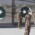 Pakistani soldiers wear facemasks on the closed border of Pakistan-Iran in Taftan on February 25, 2020 as fears over the spread of the COVID-19 coronavirus escalate following an outbreak in neighbouring Iran. - The Iranian outbreak where at least 15 people have already died -- the highest death toll in any country outside of China -- has aggravated already frayed nerves in neighbouring Afghanistan and Pakistan. (Photo by Banaras KHAN / AFP)