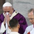 Pope Francis blows his nose as he leads the Ash Wednesday mass which opens Lent, the forty-day period of abstinence and deprivation for Christians before Holy Week and Easter, on February 26, 2020, at the Santa Sabina church in Rome. (Photo by Alberto PIZZOLI / AFP)