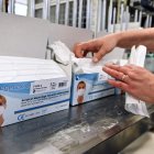 An employee packs repiratory protective face masks on an assembly line at the Valmy protective mask manufacturer plant in Mably, central France, on February 28, 2020, amid the spread of COVID-19, the novel coronavirus. The spread of the new coronavirus to Europe has boosted the activity of Valmy, one of the French protective face mask manufacturers, with the number of employees in the production plant and warehouse rising from around 20 to 60 in the past month. / AFP / PHILIPPE DESMAZES

 FRANCE-HEALTH-VIRUS-MANUFACTURING-COMPANY