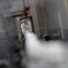 An employee of the pharmaceutical laboratory "Laboratoires Gilbert" works on a production chain of hydroalcoholic solution in Plouedern, northwestern France on March 4, 2020 as France has confirmed 204 cases of the novel coronavirus. - Fears of catching the virus have sparked a run on masks as well as sanitising hand gel in France, leading some stores and online retailers to hike prices. Finance Minister Bruno Le Maire said earlier on March 4, 2020 that he had ordered France"s consumer and anti-fraud watchdog to open an investigation after reports that prices had doubled or even tripled. (Photo by Loic VENANCE / AFP)