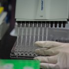 This photo taken on March 11, 2020 shows a lab techician working on a neutralising antibody test on the Middle Eastern Respiratory Syndrome (MERS) coronavirus at a Bio Safety Level (BSL) 3 laboratory at the International Vaccine Institute (IVI) in Seoul. - The COVID-19 novel coronavirus outbreak has exposed a lack of global research on ways to combat the spread of infectious diseases, with health authorities failing to learn lessons from previous flare-ups, experts said on March 3. The last outbreak of worldwide signficance was the SARS virus scare of the early 2000s, which killed 774 people, and more recently the Mers virus killed more than 850 people, although the outbreak was largely contained to the Middle East. (Photo by Ed JONES / AFP)