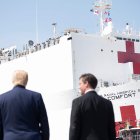 US Defense Secretary Mark Esper (R) and US President Donald Trump watch as the hospital ship USNS Comfort departs Naval Base Norfolk on March 28, 2020, in Norfolk, Virginia. The Comfort sails to New York City to aid in the coronavirus outbreak. / AFP / JIM WATSON

 US-HEALTH-VIRUS-NAVY-HOSPITAL-TRUMP