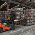 An employee works in the manufacturing of coffins at the Bignotto Funerary Urns Factory, in Cordeiropolis, Sao Paulo state, Brazil, on May 19, 2020, amid the new coronavirus pandemic. - Brazil has seen a record number of coronavirus deaths as the pandemic that has swept across the world begins to hit Latin America with its full force. (Photo by NELSON ALMEIDA / AFP)