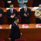 TOPSHOT - Chinese President Xi Jinping is applauded by, from left, State Councilor Xiao Jie, Foreign Minister Wang YiState Councilor Wang Yong, and Defence Minister Wei Fenghe, as he arrives for the closing session of the National People"s Congress at the Great Hall of the People in Beijing on May 28, 2020. China"s rubber-stamp parliament endorsed plans May 28 to impose a national security law on Hong Kong that critics say will destroy the city"s autonomy.  / AFP / NICOLAS ASFOURI

 TOPSHOTS-TOPSHOT-CHINA-POLITICS
