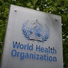 (FILES) In this file photo taken on May 12, 2020 shows a sign of the World Health Organization (WHO) in Geneva next to their headquarters, amid the COVID-19 outbreak, caused by the novel coronavirus. - President Donald Trump said May 29, 2020, he was breaking off US ties with the World Health Organization, which he says failed to do enough to combat the initial spread of the novel coronavirus. (Photo by Fabrice COFFRINI / AFP)