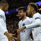 Paris Saint-Germain"s Spanish defender Juan Bernat (C) celebrates with Paris Saint-Germain"s Brazilian forward Neymar (R) and Paris Saint-Germain"s French forward Kylian Mbappe (L) after scoring a goal during the UEFA Champions League Group C football match between Paris Saint-Germain (PSG) and Liverpool FC at the Parc des Princes stadium, in Paris, on November 28, 2018. (Photo by FRANCK FIFE / AFP) FBL-EUR-C1-PSG-LIVERPOOL