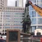 A video grab taken from a video released by Tower Hamlets council shows a statue of Scottish slaveholder Robert Milligan being removed from West India Quay, east London on June 10, 2020. (Photo by Handout / TOWER HAMLETS COUNCIL / AFP) / RESTRICTED TO EDITORIAL USE - MANDATORY CREDIT "AFP PHOTO / TOWER HAMLETS COUNCIL " - NO MARKETING - NO ADVERTISING CAMPAIGNS - DISTRIBUTED AS A SERVICE TO CLIENTS