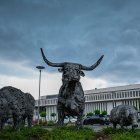 Animal sculptures are pictured in front of the headquarters of abattoir company Toennies in Rheda-Wiedenbrueck on June 17, 2020. The company stopped its production after 400 employees were tested positive on the covid-19 coronavirus. / AFP / Sascha Schuermann

 GERMANY-HEALTH-VIRUS