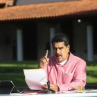 Handout picture released by the Venezuelan Presidency showing Venezuela"s President Nicolas Maduro announcing in a televised message to the nation the extension, for the fifth time, of the state of alarm due to the COVID-19 novel coronavirus pandemic, in Caracas on August 9, 2020. (Photo by - / Venezuelan Presidency / AFP) / RESTRICTED TO EDITORIAL USE - MANDATORY CREDIT "AFP PHOTO / VENEZUELA"S PRESIDENCY" - NO MARKETING - NO ADVERTISING CAMPAIGNS - DISTRIBUTED AS A SERVICE TO CLIENTS