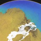 03-02-2022 Esta imagen conceptual revela cómo pudo haber sido la región de Kasei Valles en Marte hace tres mil millones de años. Las áreas blancas son glaciares y el azul representa el océano.. Un nuevo estudio financiado por la NASA y socios internacionales indica que el periodo en que Marte tuvo una atmósfera más gruesa y océanos de agua líquida pudo haber durado más de lo que pensado. POLITICA INVESTIGACIÓN Y TECNOLOG