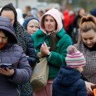 Refugiados ucraniados camino a Bélgica, a causa de la invasión de Rusia a su país.