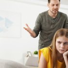 Father scolding his teenager daughter at home