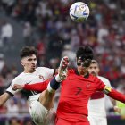 Heungmin Son (R) of South Korea in action against Vitinha of Portugal during the FIFA World Cup 2022 group H soccer match between South Korea and Portugal at Education City Stadium in Doha, Qatar, 02 December 2022.