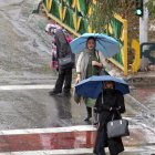 Tehran (Iran (islamic Republic Of)), 04/12/2022.- Women wait for a taxi in a street on a rainy day in Tehran, Iran, 04 December 2022. According to Iran"s state news agency ISNA, prosecutor general Mohammad Jafar Montazeri clarified on 03 December 2022 that the Guidance Patrol, as the morality police is formally called, "has nothing to do with the judiciary, and it was closed from the same place it was established in the past." The veiling in the country was one of the judiciary"s main concerns though, Montazeri said. Iran has been facing anti-government protests since the death of Kurdish Iranian woman Mahsa Amini in September days after her arrest for allegedly violating dressing rules. (Protestas, Teherán) EFE/EPA/STRINGER
