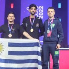 Hassan Pajani, de Irán (c), junto Spek de Freitas y Williams Freire Méndez.