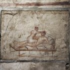 Uno de los frescos de la Casa de los Vettii, una de las domus mejor conservadas de la urbe romana de Pompeya.