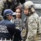 La exsenadora colombiana Aida Merlano llega escoltada a las instalaciones de la Dirección de Investigación Criminal e Iinterpol, hoy, luego de su arribo Bogotá (Colombia)